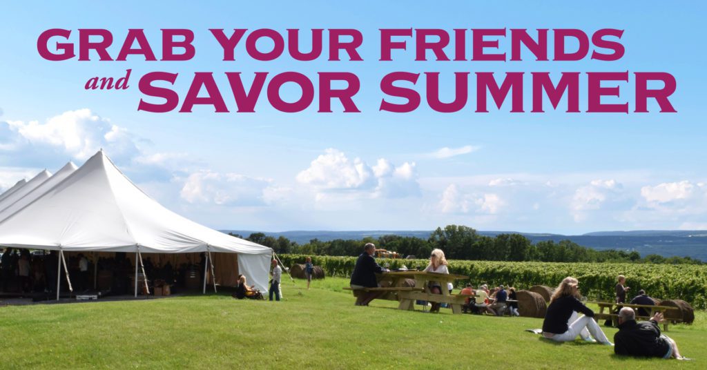 Tent and people on winery grass