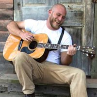 Evan Dillon playing guitar
