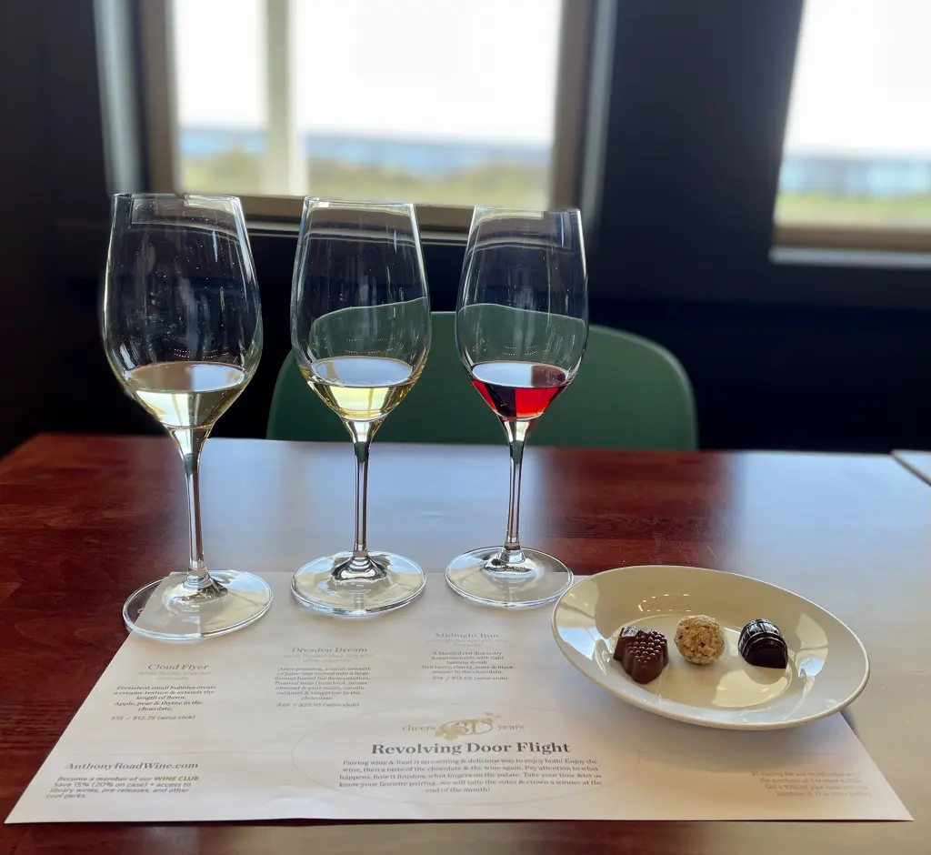 Revolving Door Flight includes 3 glasses of wine (2 white and 1 red) and 3 pieces of chocolate