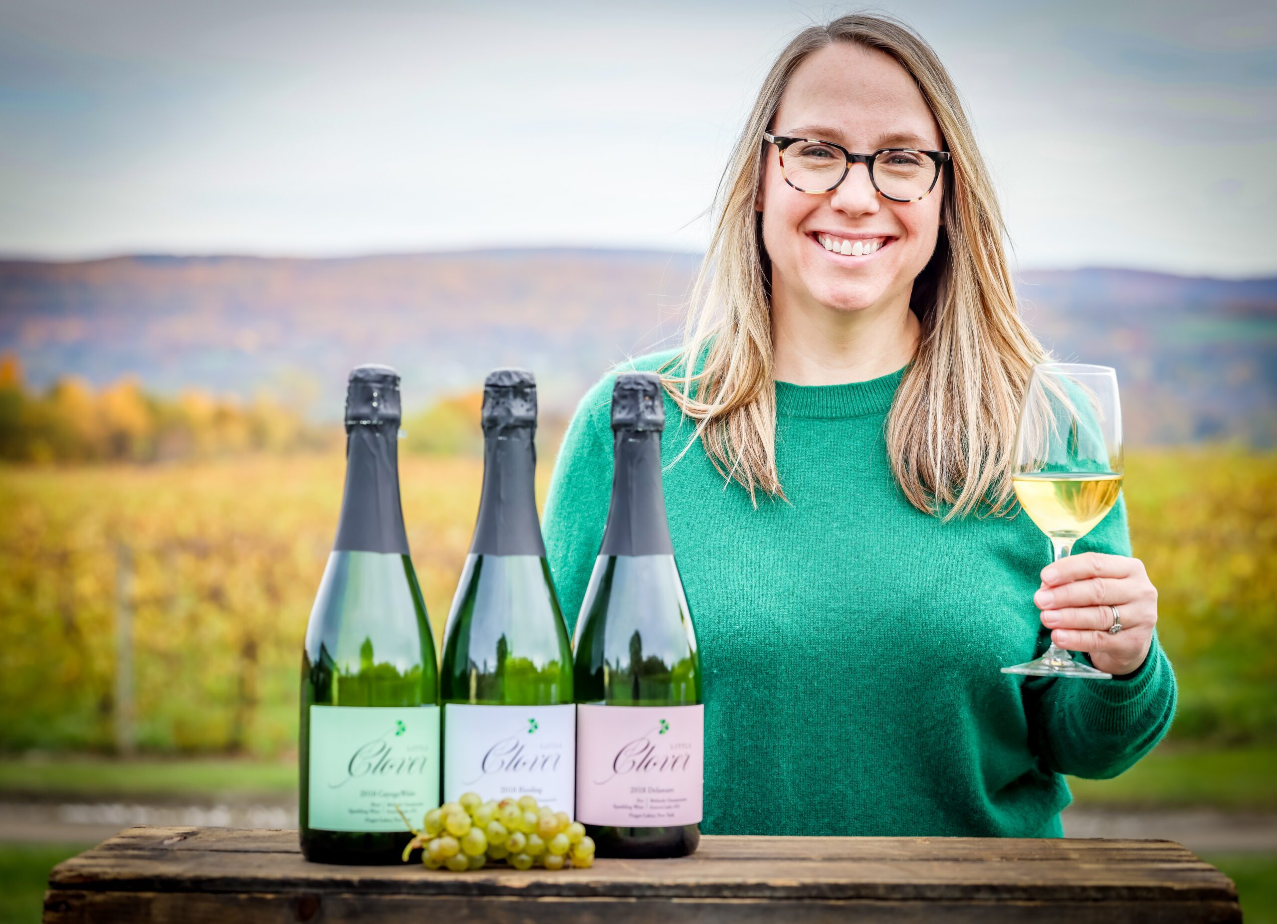 Erin McMurrough with three bottles of Little Clover wine