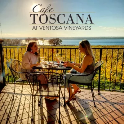 Cafe Toscana view of lake, two women eating on the terrace