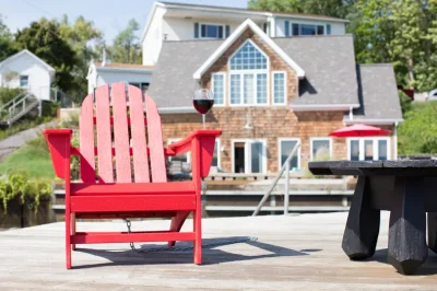 Get Redy Vacation Rentals lakehome with Adirondack chair