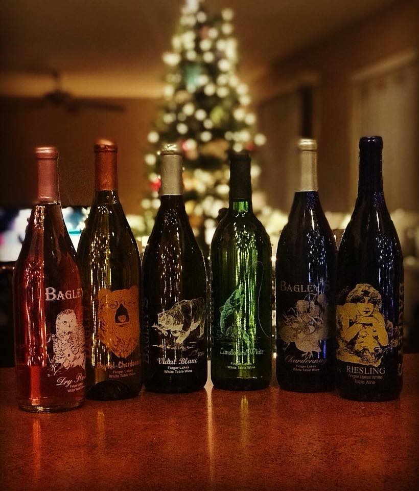 Wine bottles with Christmas tree in background