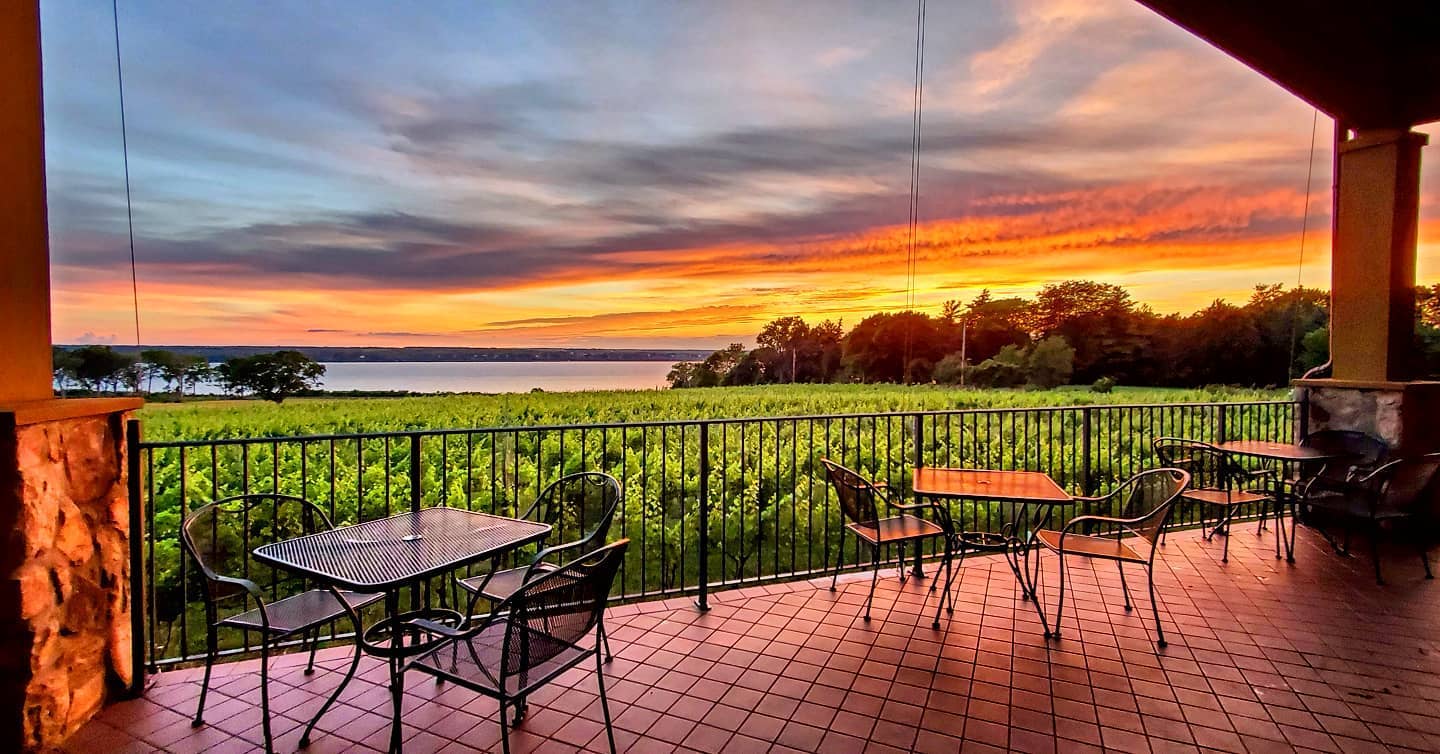 View of a sunset from a outdoor patio at Ventosa Vineyards overlooking Seneca Lake